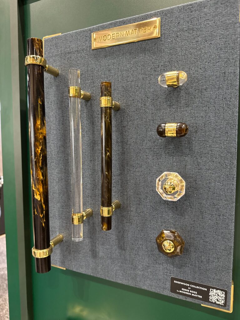 Image shows cabinet pulls by Modern Matter. Shows pulls in a variety of shapes and sizes. The Edgewood Pull mixes lucite, acrylic, and brass to create a polished appeal.  Displayed in clear and tortoise pattern. 